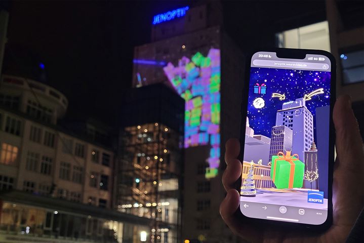 Using a smartphone to digitally flick presents onto the Jenoptik high-rise