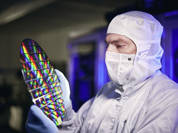 Cleanroom employee with wafer