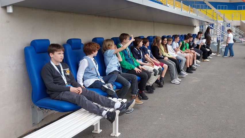 As part of the supporting program, the students explored the stadium and the took a seat at the trainer's bench.