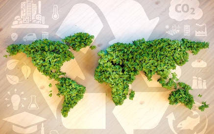 World map made of plants with recycling logo