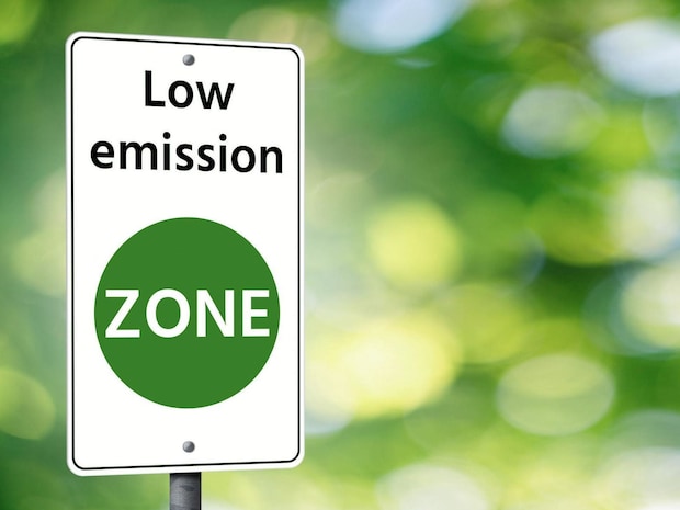 Traffic sign with Low Emission Zone on green background