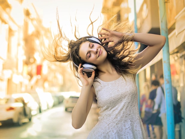 gril dance with headset to the music