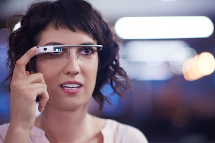 Woman using small virtual reality glasses