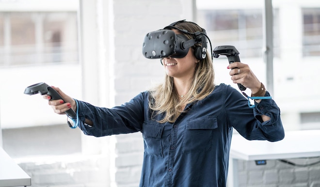 Woman using virtual reality (VR) goggles for digital imaging