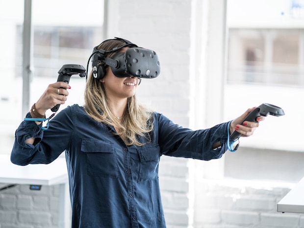 Woman using virtual reality (VR) goggles for digital imaging