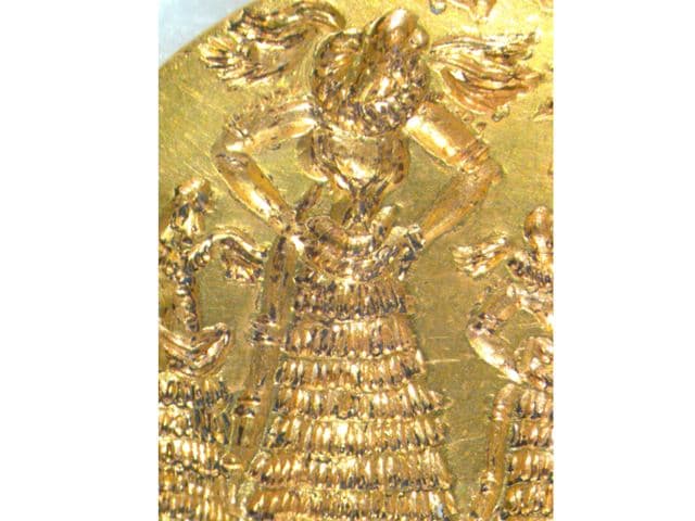 Microscope image of gold signet ring: goddess in a worship scene